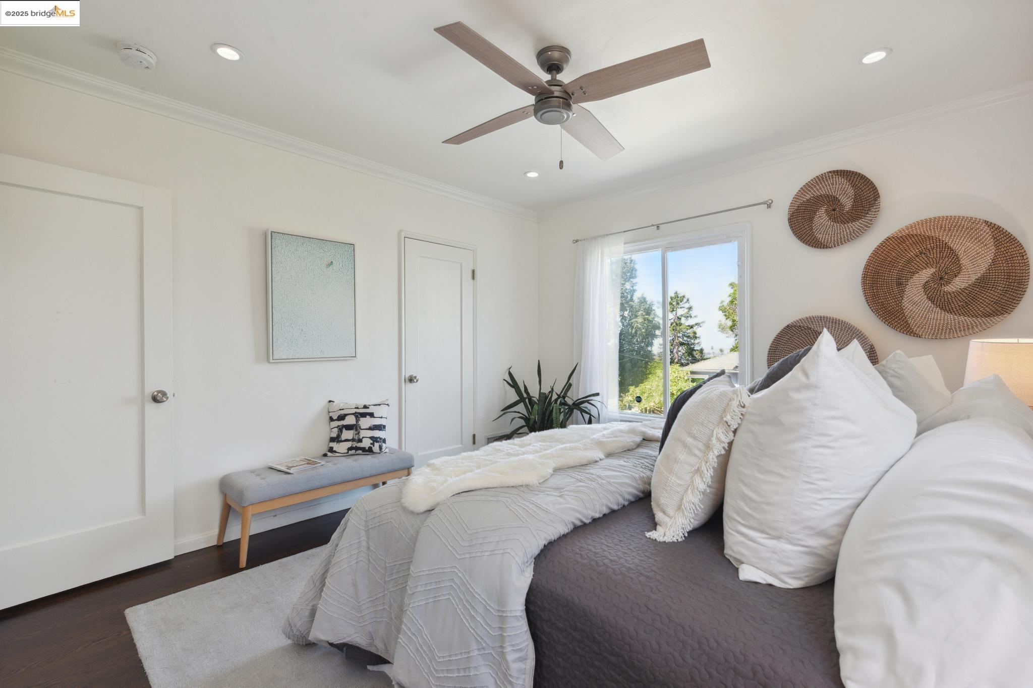 Undisclosed Address Oakland, CA 94619 - Photo 25 of 60 a bedroom with a bed and a chandelier