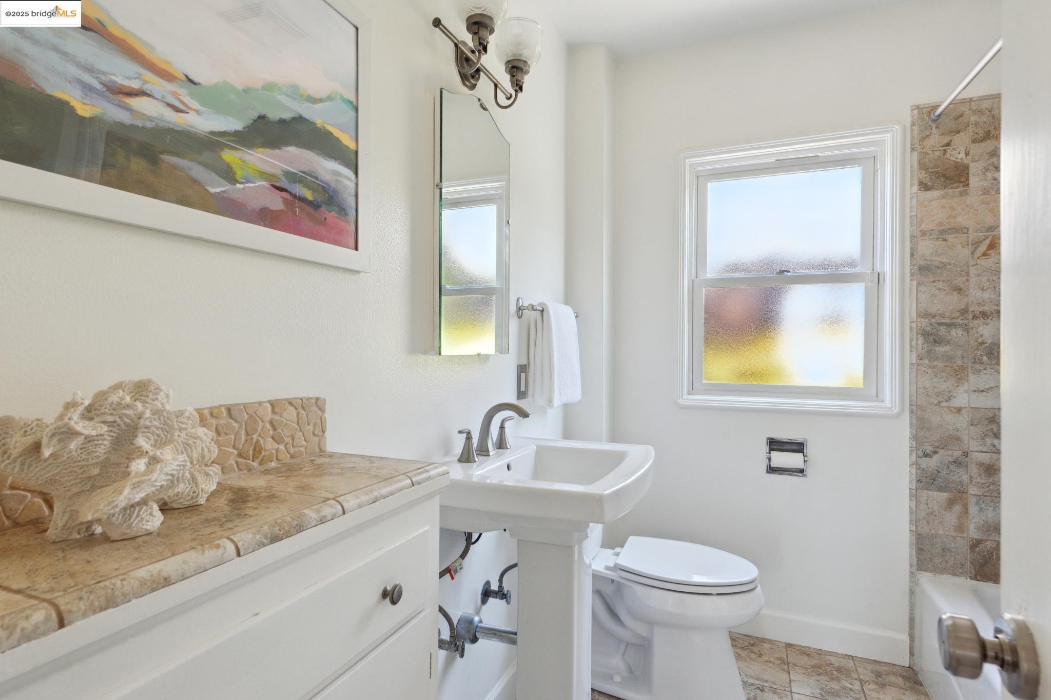 Undisclosed Address Oakland, CA 94619 - Photo 27 of 60 a bathroom with a sink and a toilet