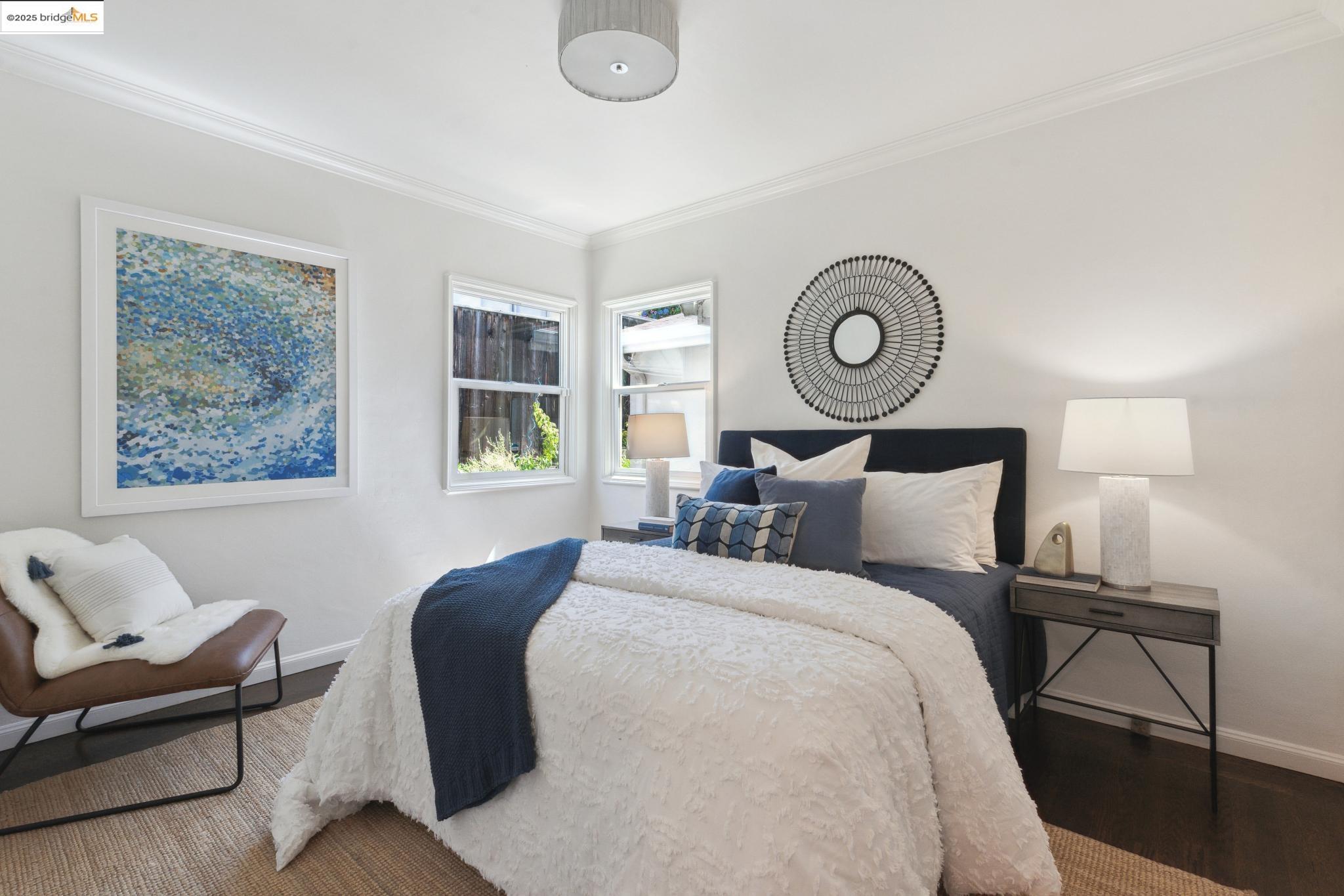 Undisclosed Address Oakland, CA 94619 - Photo 28 of 60 a bed room with a bed and a chair