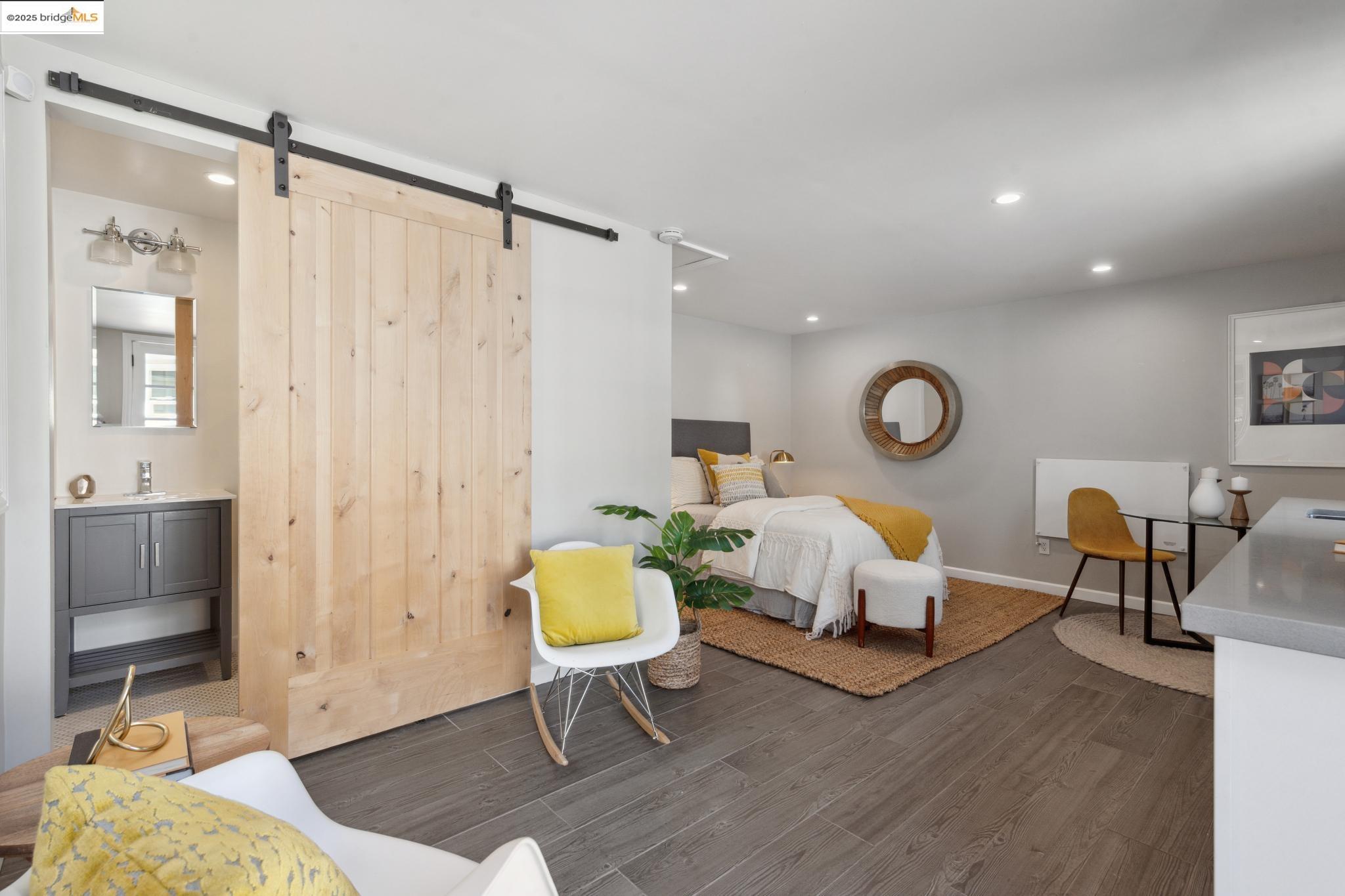 Undisclosed Address Oakland, CA 94619 - Photo 37 of 60 a living room with a couch and a table