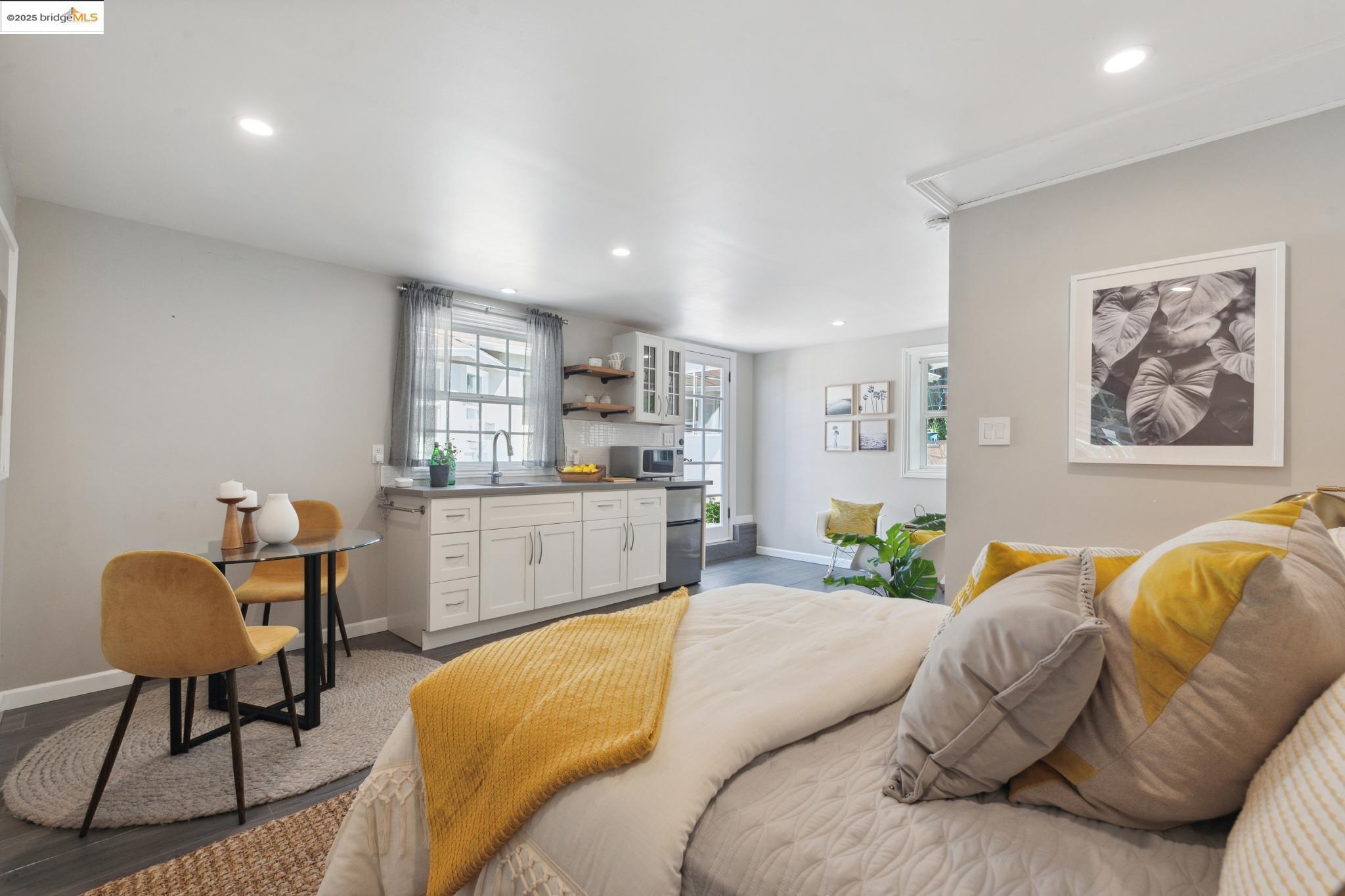 Undisclosed Address Oakland, CA 94619 - Photo 40 of 60 a living room with furniture and a kitchen