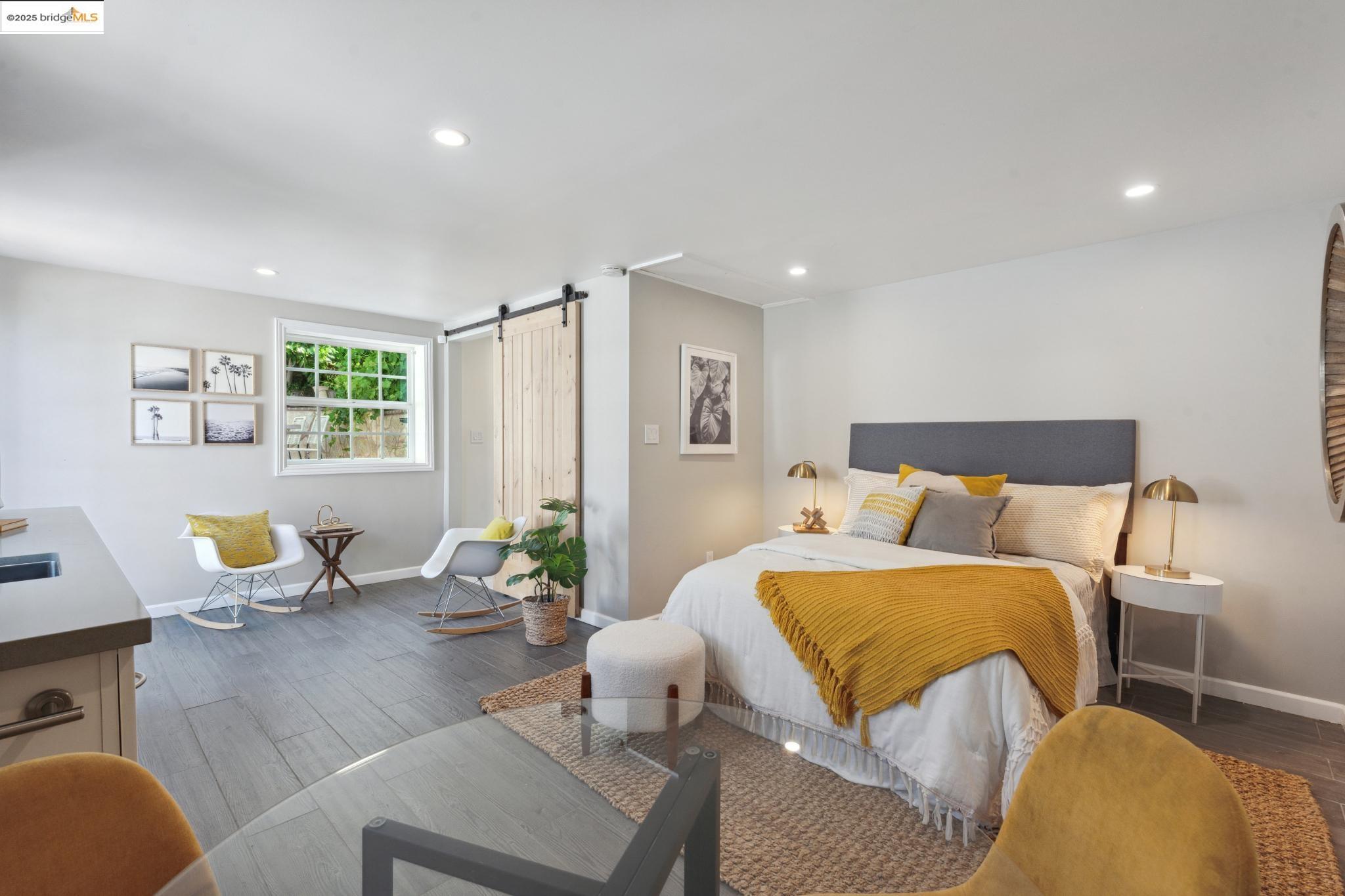 Undisclosed Address Oakland, CA 94619 - Photo 41 of 60 a bedroom with furniture and wooden floor