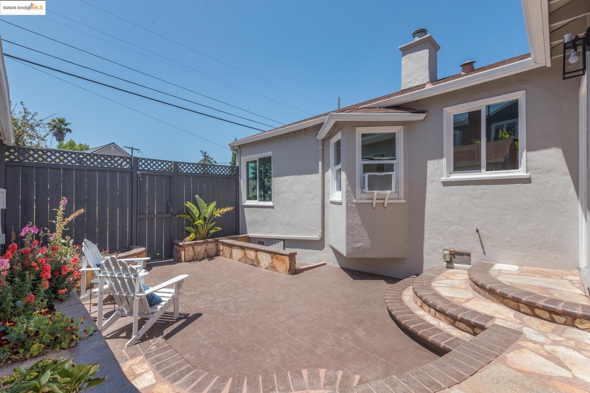 Undisclosed Address Oakland, CA 94619 - Photo 49 of 60 a wooden bench sitting in front of a house