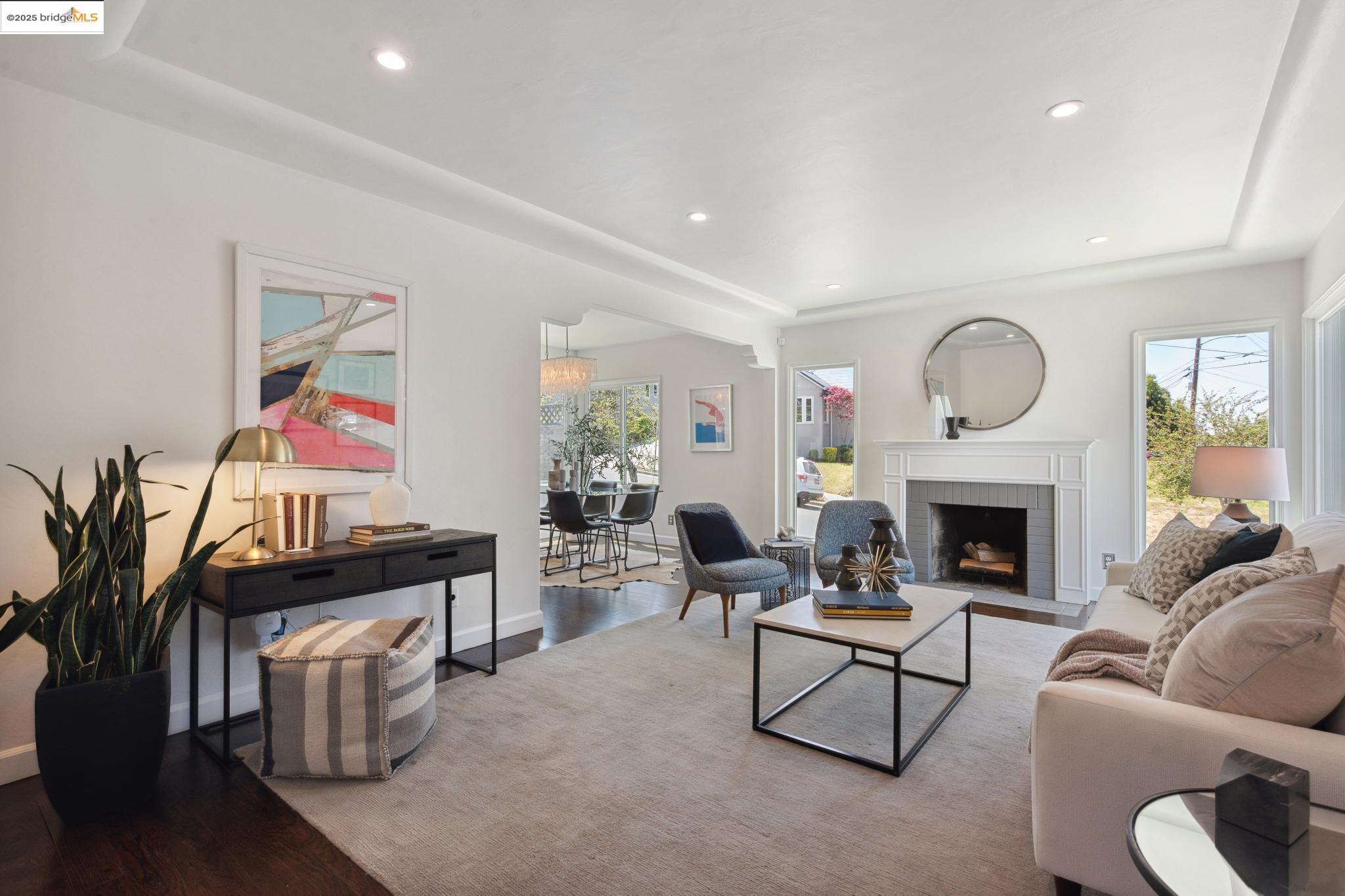 Undisclosed Address Oakland, CA 94619 - Photo 5 of 60 a living room with furniture and a fireplace