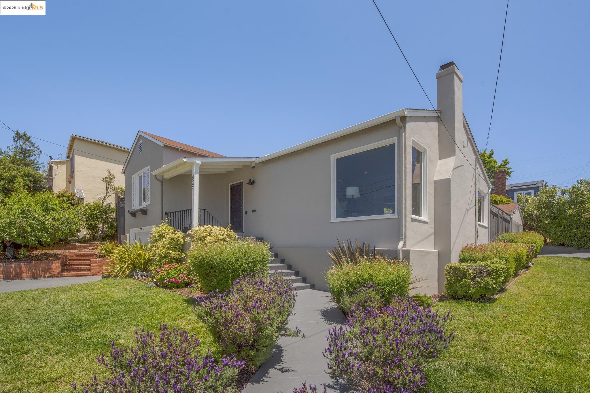 Undisclosed Address Oakland, CA 94619 - Photo 51 of 60 a front view of a house with garden