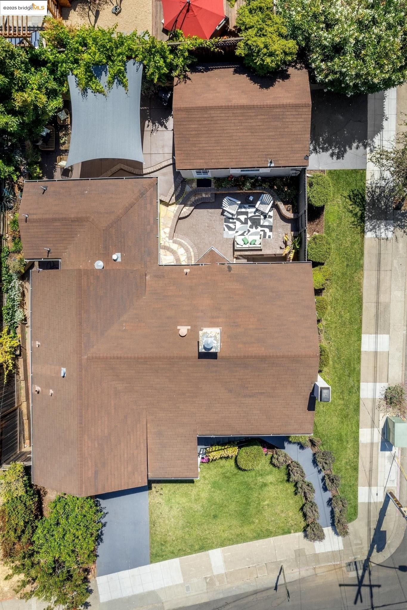 Undisclosed Address Oakland, CA 94619 - Photo 53 of 60 an aerial view of a house with a yard and a car park