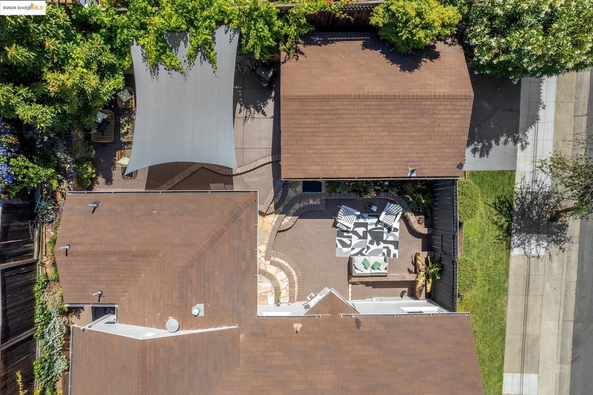 Undisclosed Address Oakland, CA 94619 - Photo 54 of 60 an aerial view of a house with a yard and garage