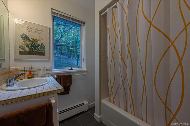 a bathroom with a sink and a window