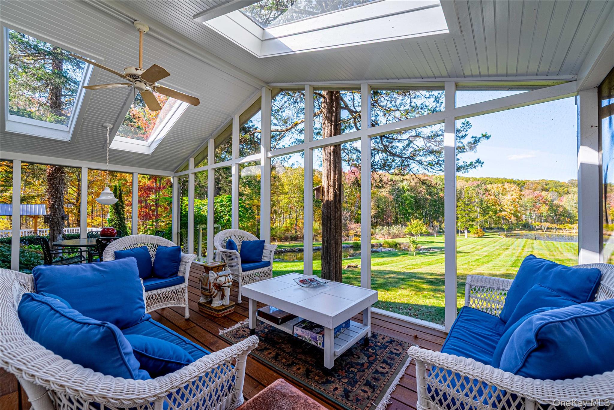 29 West Lake Road Warwick, NY 10990 - Photo 14 of 35 a living room with furniture and a floor to ceiling window