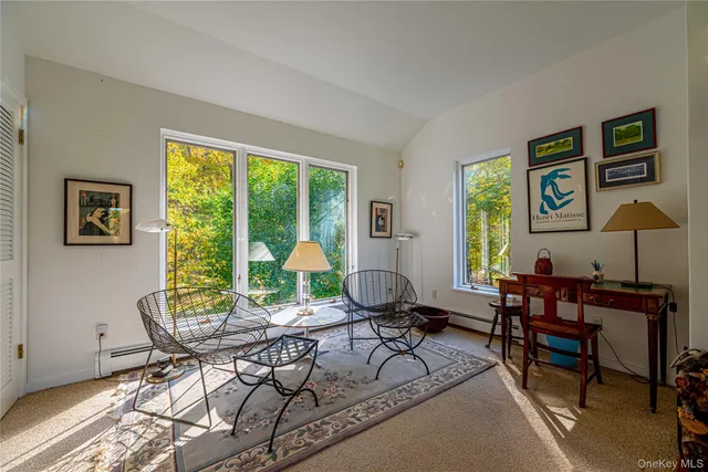 a workspace with furniture and a window