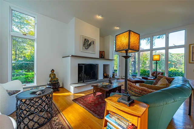 a living room with furniture fireplace and window