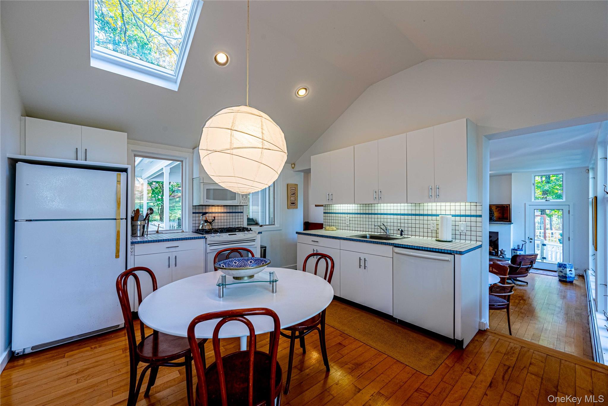 29 West Lake Road Warwick, NY 10990 - Photo 10 of 35 a kitchen with stainless steel appliances granite countertop a kitchen island a stove a table and a refrigerator