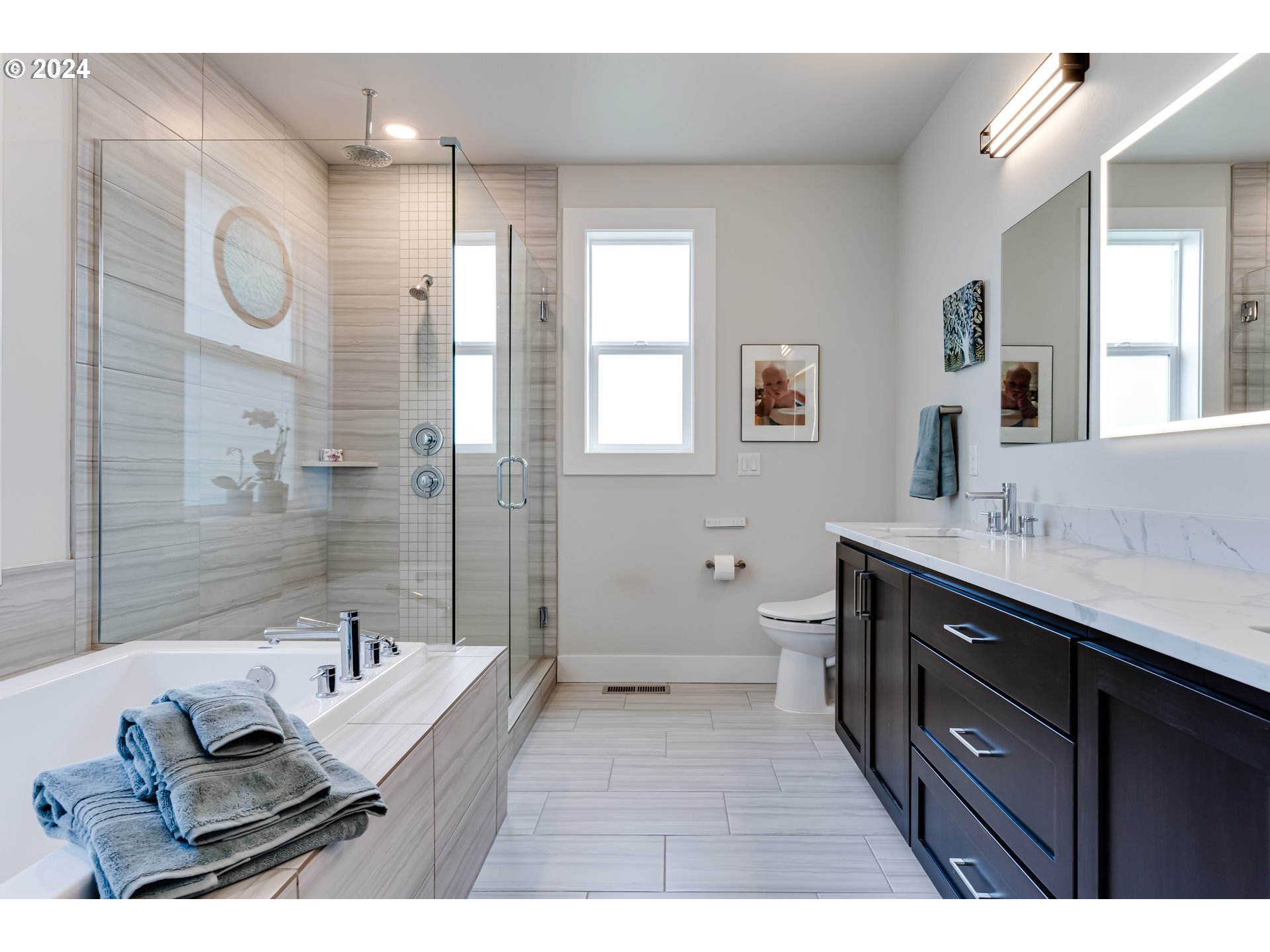 1876 John Day Drive Eugene, OR 97408 - Photo 17 of 43 a bathroom with a sink double vanity granite tub shower and a mirror