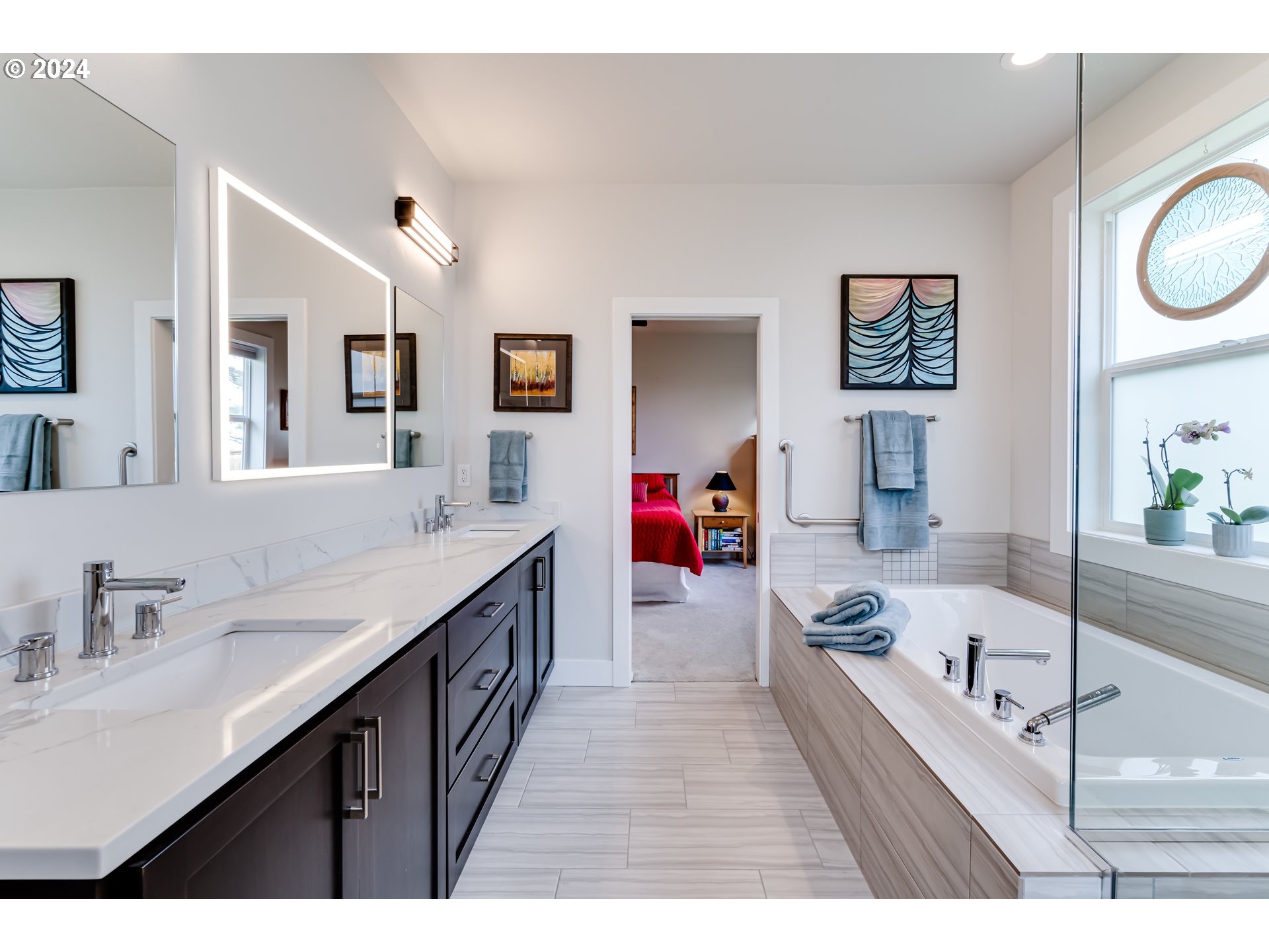 1876 John Day Drive Eugene, OR 97408 - Photo 18 of 43 a bathroom with a bathtub a sink a mirror and a shower