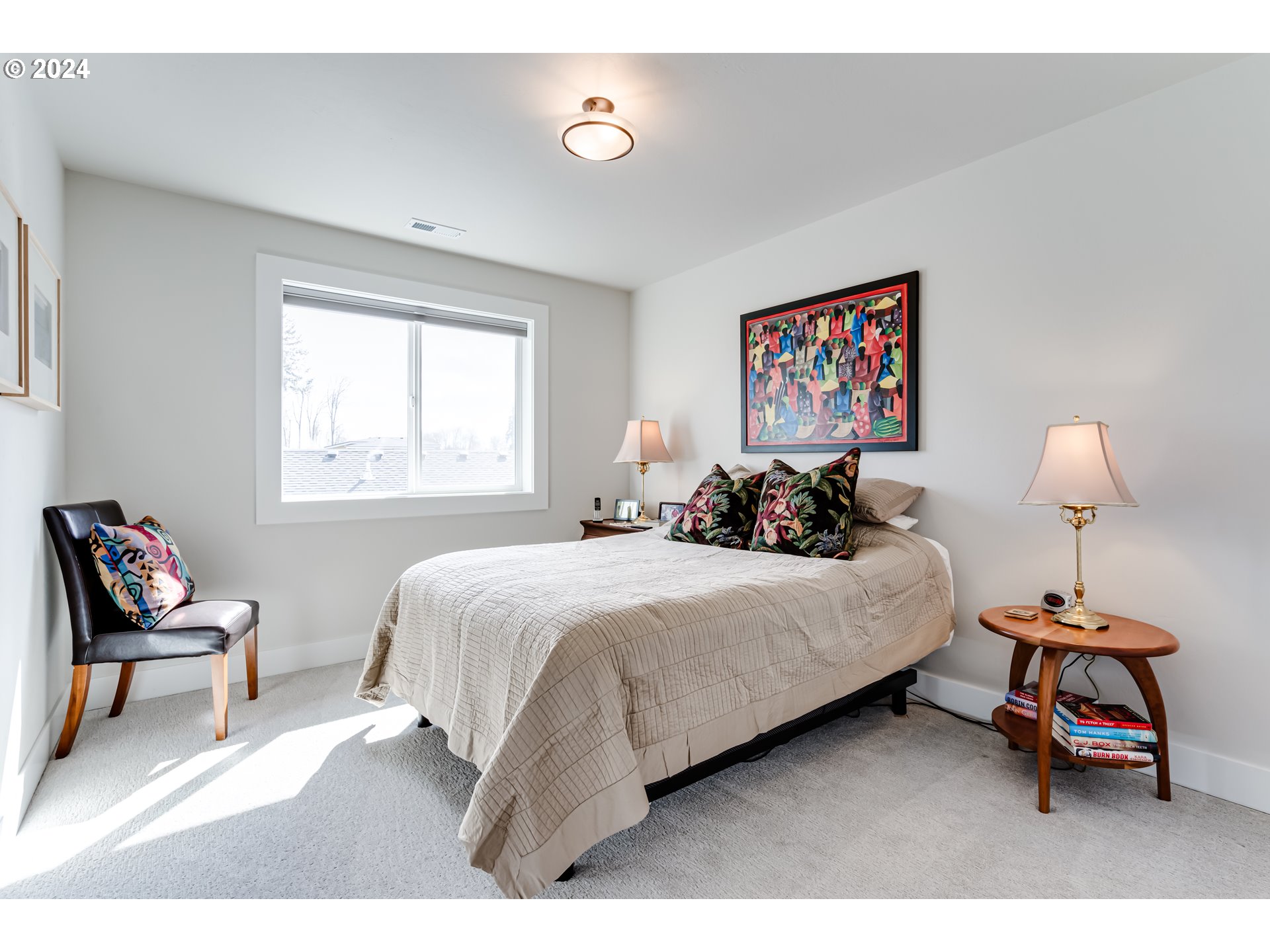 1876 John Day Drive Eugene, OR 97408 - Photo 32 of 43 a bedroom with a bed and a chair