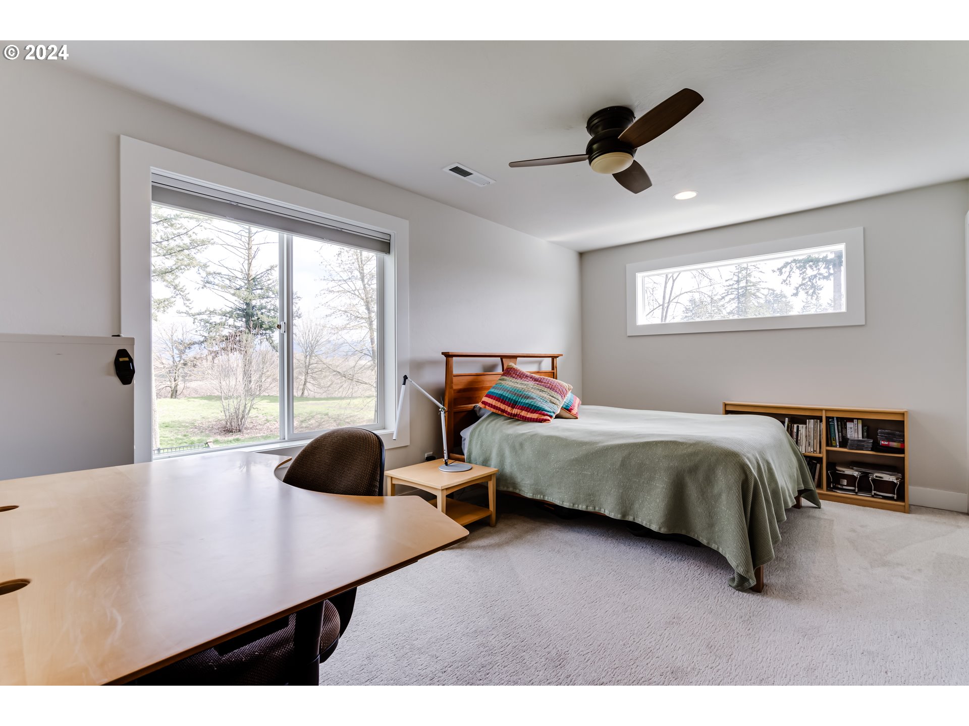 1876 John Day Drive Eugene, OR 97408 - Photo 34 of 43 a bedroom with a bed and a large window
