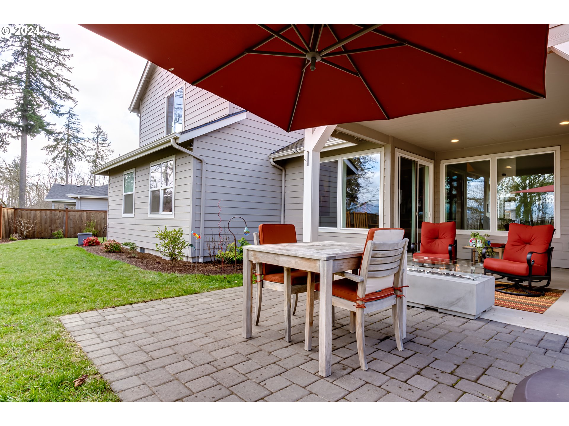 1876 John Day Drive Eugene, OR 97408 - Photo 38 of 43 a dinning table and chair under an umbrella