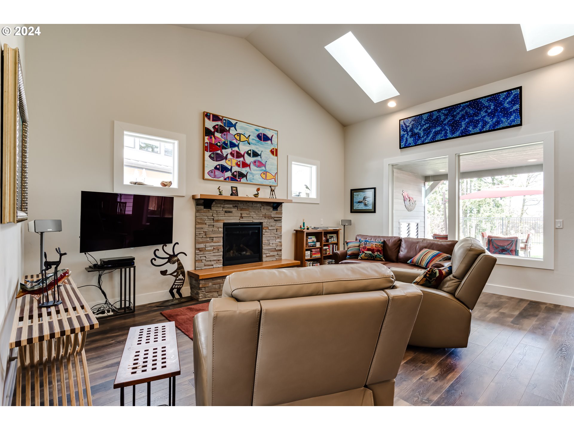 1876 John Day Drive Eugene, OR 97408 - Photo 4 of 43 a living room with furniture a flat screen tv and a fireplace
