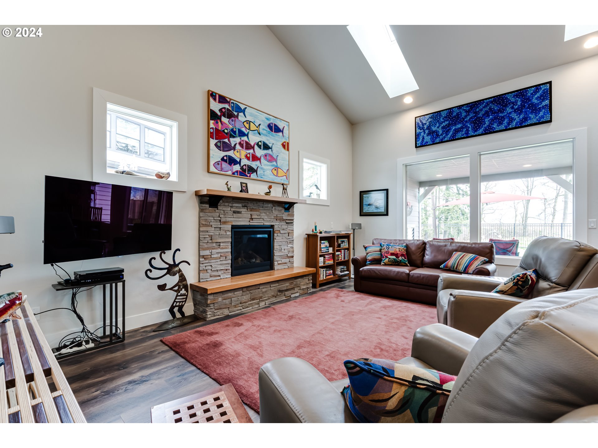 1876 John Day Drive Eugene, OR 97408 - Photo 5 of 43 a living room with furniture a flat screen tv and a fireplace