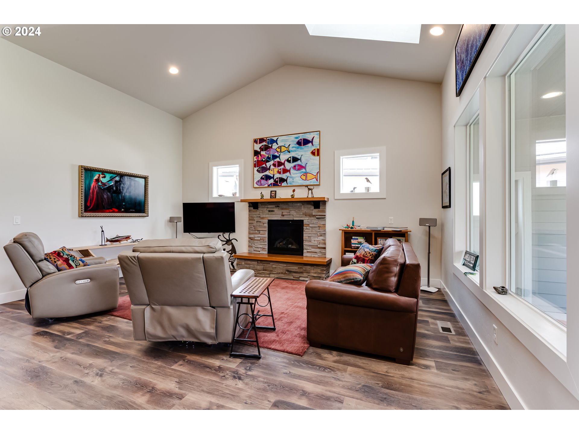 1876 John Day Drive Eugene, OR 97408 - Photo 6 of 43 a living room with furniture a flat screen tv and a fireplace