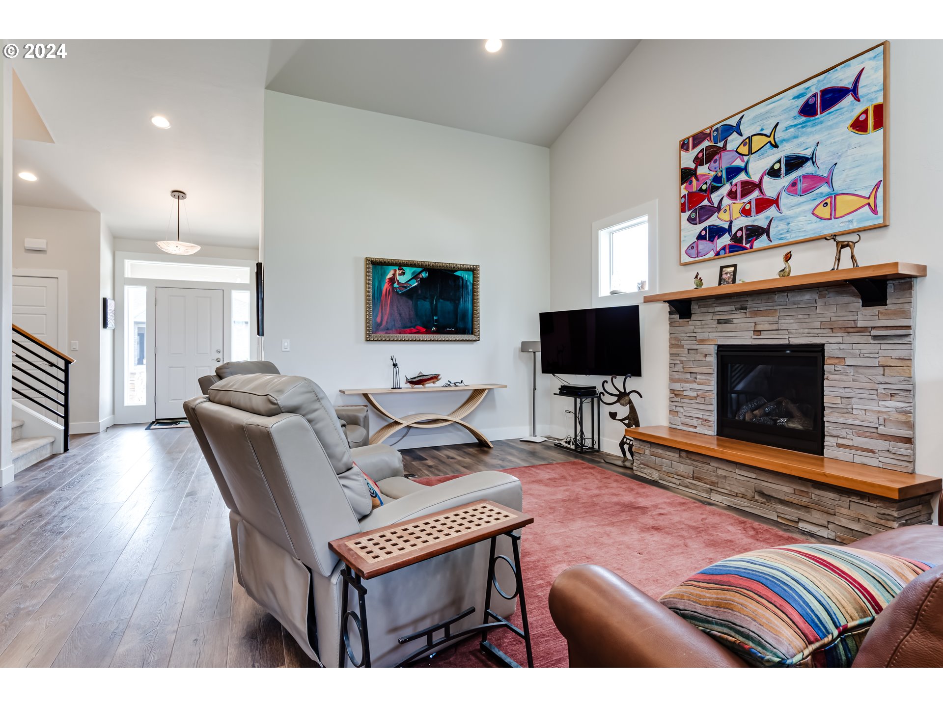 1876 John Day Drive Eugene, OR 97408 - Photo 7 of 43 a living room with furniture a flat screen tv and a fireplace