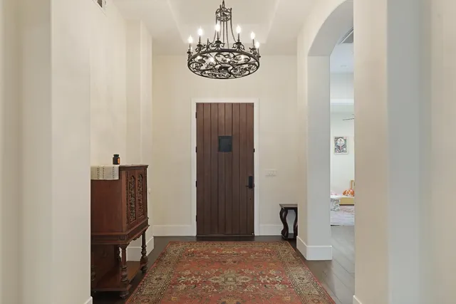 a view of a hallway with front door