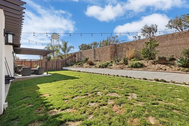 a view of a garden with a building in the background