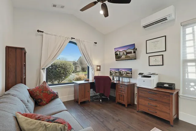 a living room with furniture and a window