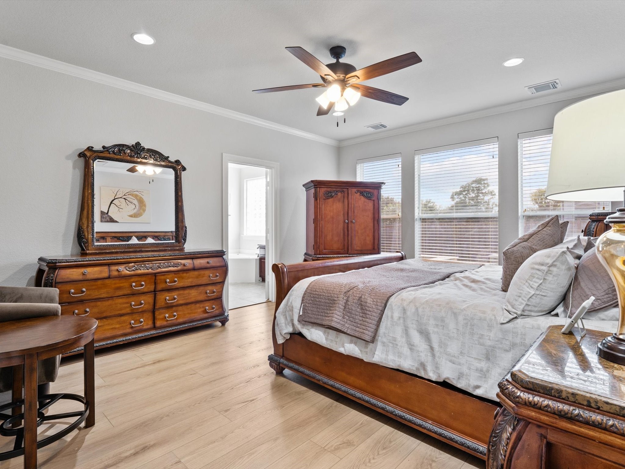 6003 Tarra Firma Drive Spring, TX 77379 - Photo 17 of 43 This stunning primary suite offers the ultimate in convenience and luxury. Wake up to peaceful pool views every morning in a space designed for total relaxation. This master suite combines grand proportions with a serene atmosphere to create your own personal sanctuary.