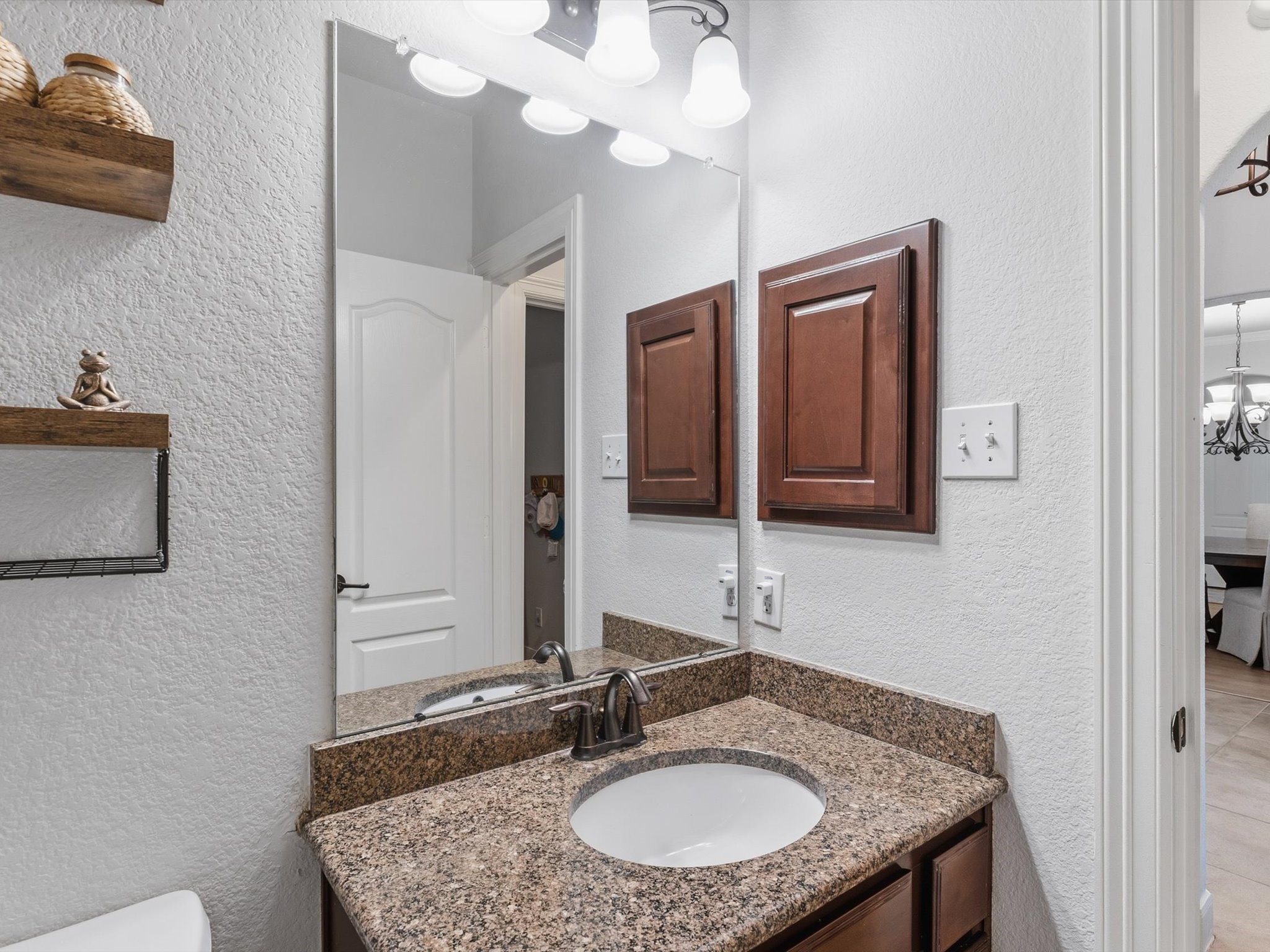 6003 Tarra Firma Drive Spring, TX 77379 - Photo 23 of 43 This secondary full bathroom is perfectly located on the first floor to serve both guests and residents. Featuring high-quality finishes and a full-size shower or tub, it adds an extra layer of versatility to the home's main living level.