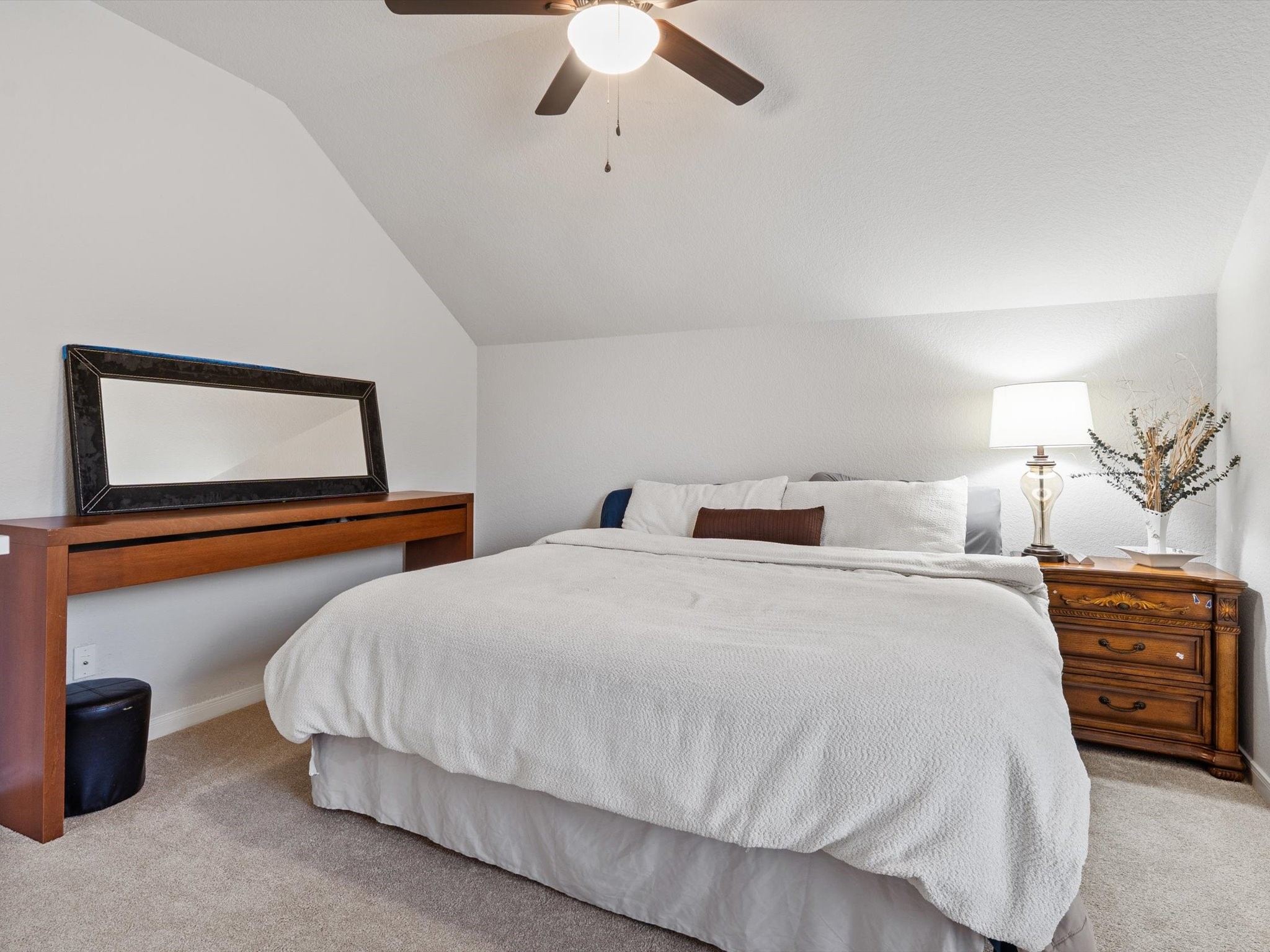 6003 Tarra Firma Drive Spring, TX 77379 - Photo 34 of 43 This is one of three generous bedrooms located on the second floor. Featuring ample closet space and large windows, it serves as a perfect retreat for family members or guests. Each room upstairs is designed with comfort and versatility in mind to ensure everyone has their own private sanctuary.