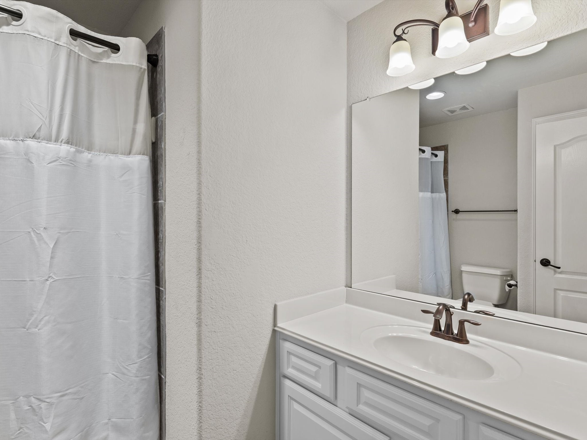 6003 Tarra Firma Drive Spring, TX 77379 - Photo 37 of 43 The second floor is designed for maximum convenience with two full bathrooms serving the upstairs bedrooms. No more waiting in line during the morning rush. Each bathroom is beautifully appointed with modern fixtures and high-quality finishes to ensure comfort for family and guests alike.