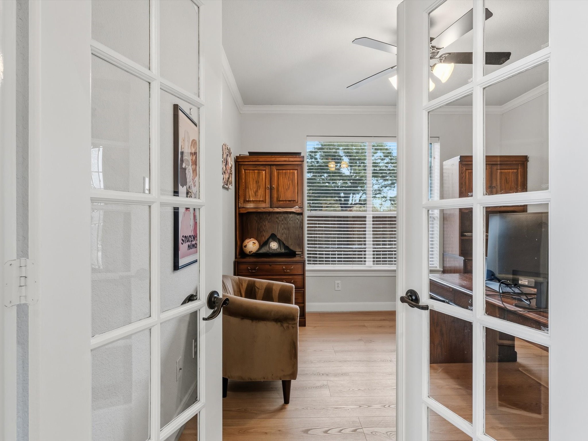 6003 Tarra Firma Drive Spring, TX 77379 - Photo 6 of 43 Executive home office located off the entry features classic French doors, offering the perfect private environment for remote work or a quiet library