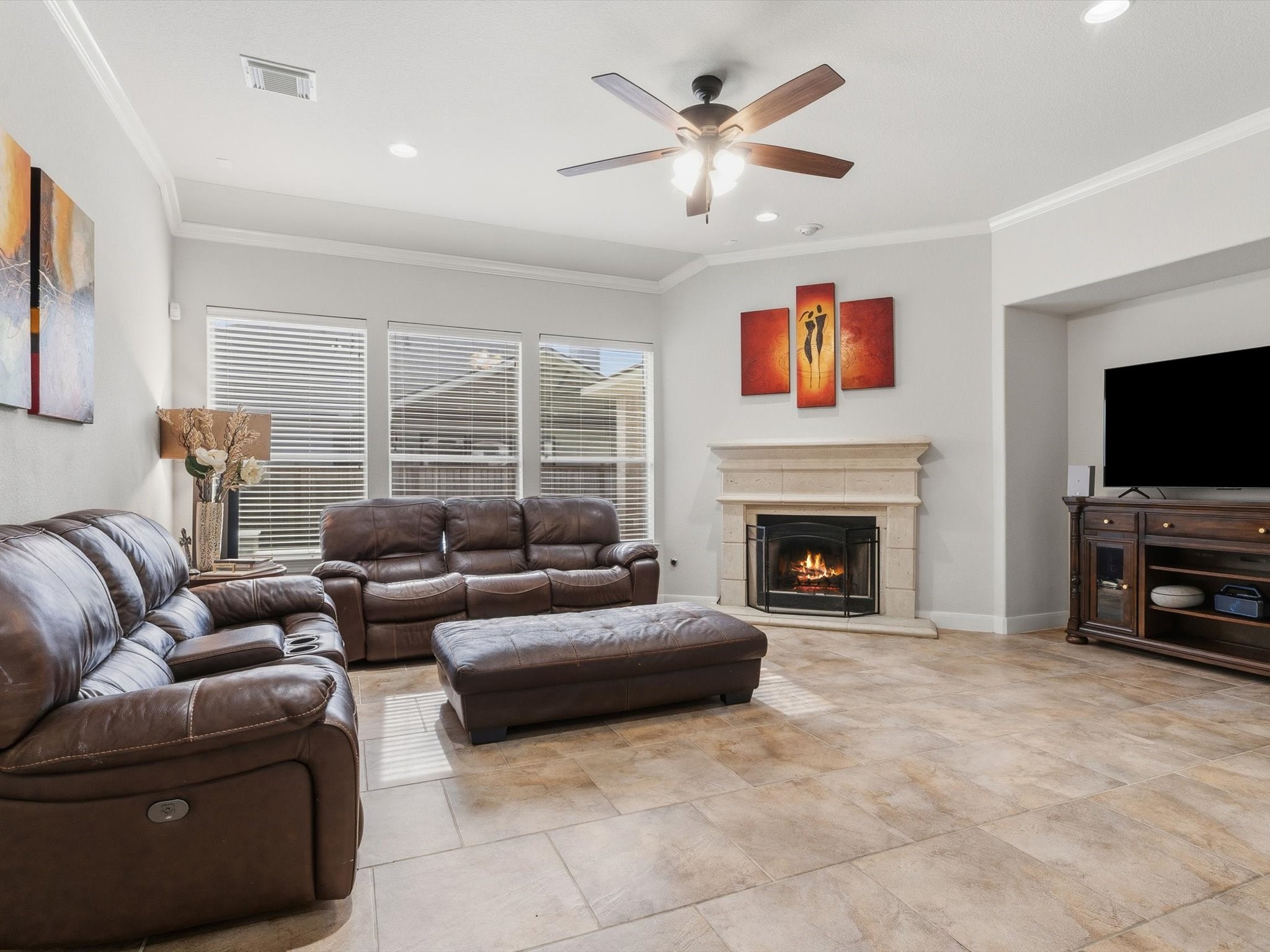6003 Tarra Firma Drive Spring, TX 77379 - Photo 8 of 43 Light-filled family room featuring panoramic views of the pool and a direct, open connection to the gourmet kitchen