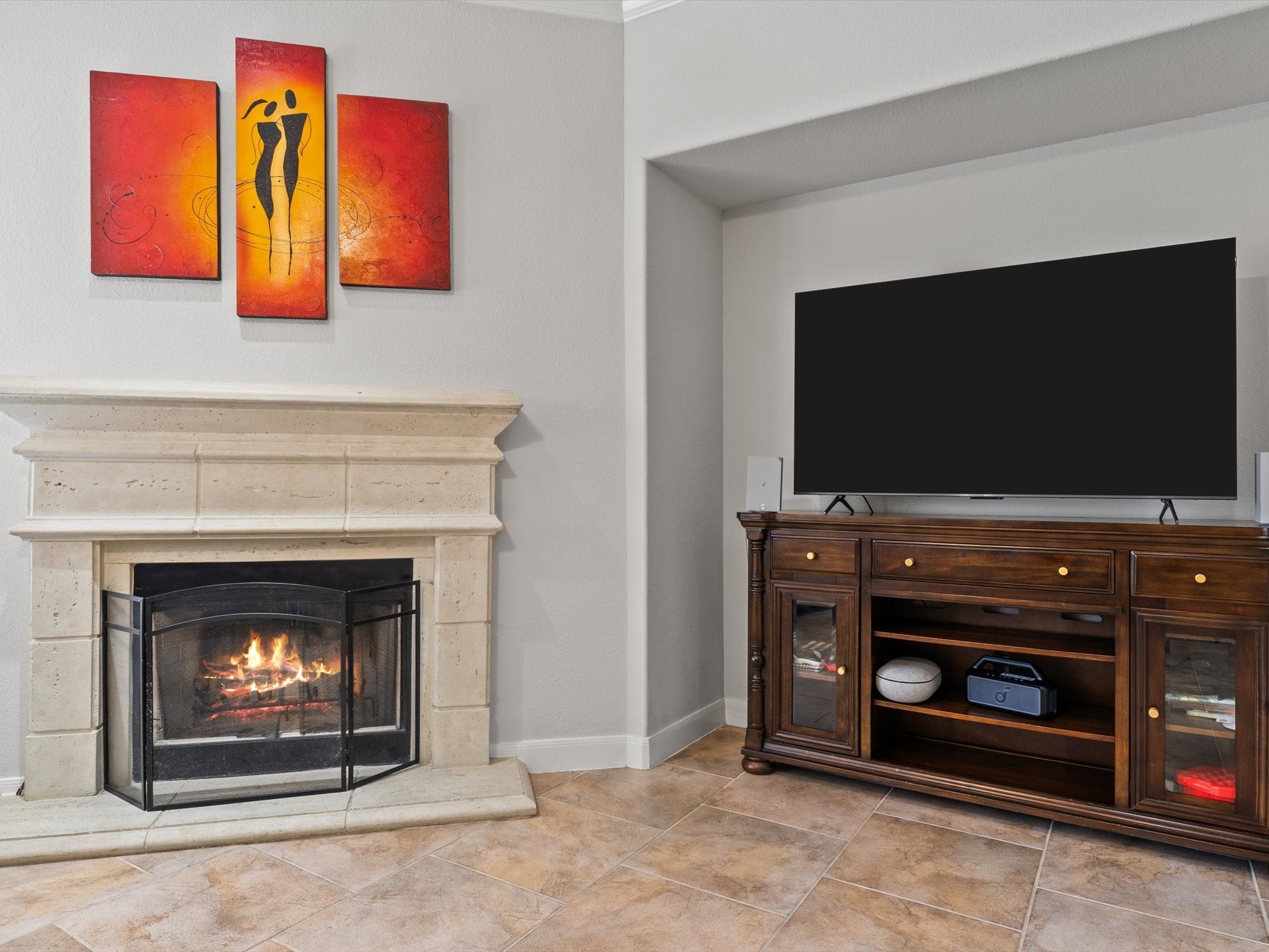 6003 Tarra Firma Drive Spring, TX 77379 - Photo 9 of 43 A gas fireplace is a major selling point because it represents both luxury and convenience—no wood to chop, just instant ambiance. For SEO, we want to capture the "cozy" vibes while using technical keywords that help with filtration on real estate sites.
Here is the optimization for your living room fireplace photo:
1. The "Punchy" Caption
Cozy Up at the Touch of a Button. This stunning gas fireplace serves as the sophisticated centerpiece of the living room. Whether you’re hosting a movie night or c