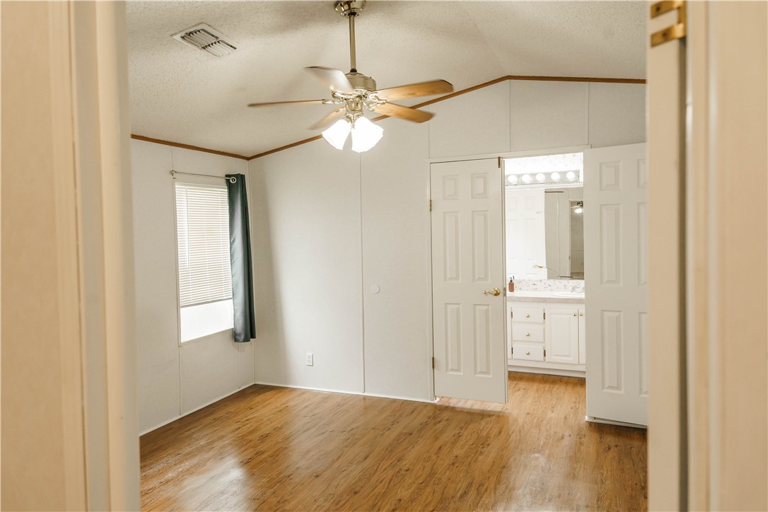 207 Dunbar Street Refugio, TX 78377 - Photo 18 of 39 double doors leading to primary bath