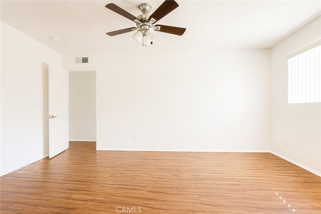 18619 Collins Street, Unit F29 Tarzana, CA 91356 - Photo 13 of 29 a view of an empty room with wooden floor