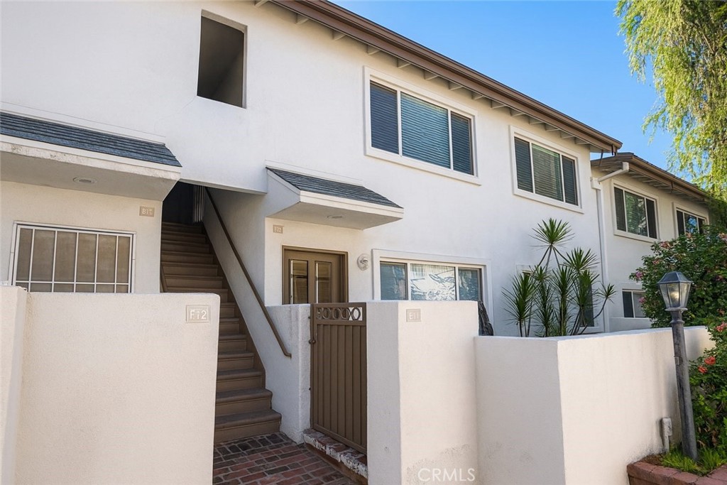 18619 Collins Street, Unit F29 Tarzana, CA 91356 - Photo 15 of 29 a view of entryway with a house and door