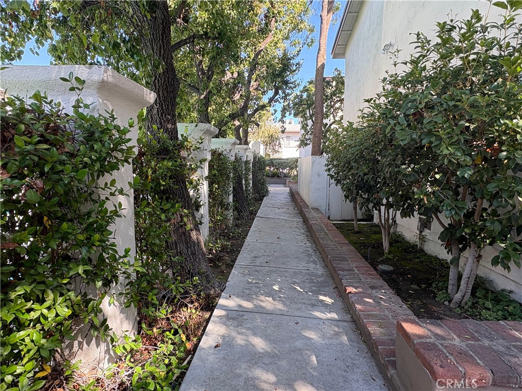 18619 Collins Street, Unit F29 Tarzana, CA 91356 - Photo 19 of 29 a view of an outdoor space with a yard
