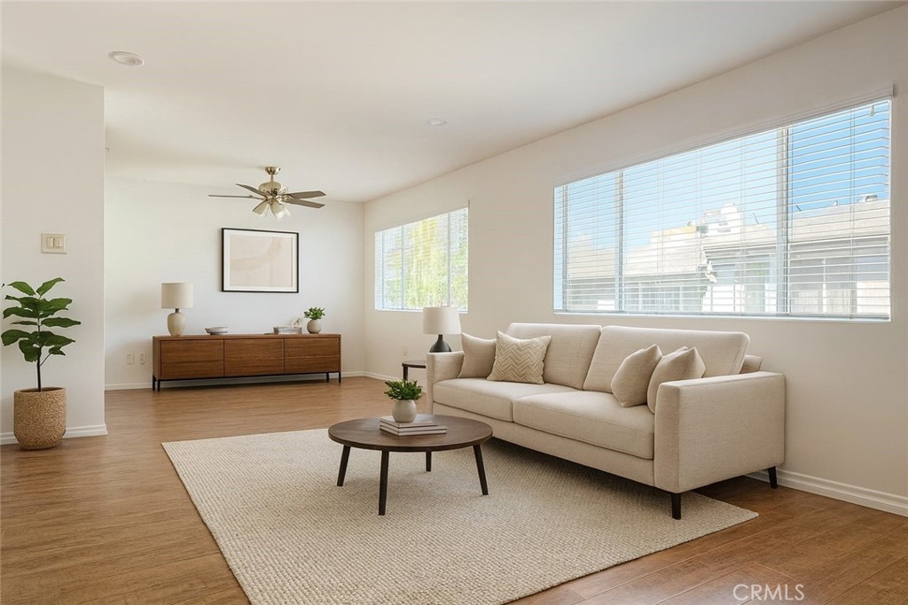 18619 Collins Street, Unit F29 Tarzana, CA 91356 - Photo 2 of 29 a living room with furniture and a large window