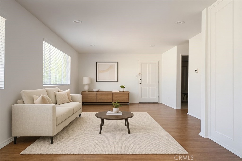 18619 Collins Street, Unit F29 Tarzana, CA 91356 - Photo 3 of 29 a living room with furniture a rug and a window