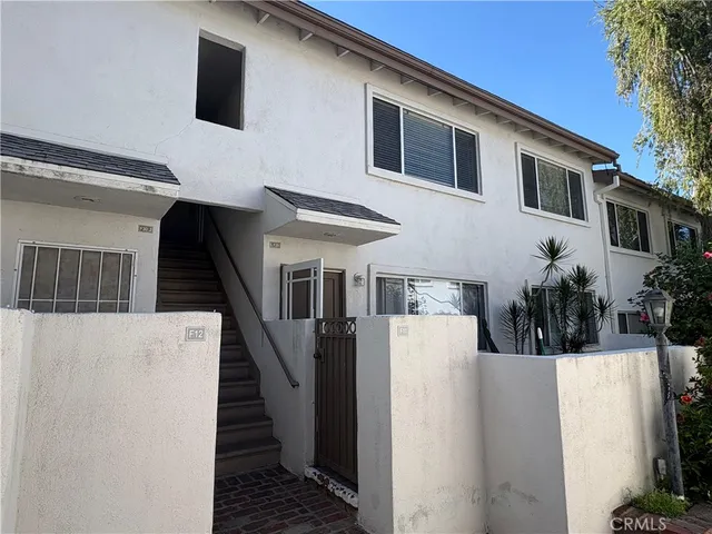 a view of outdoor kitchen with seating area