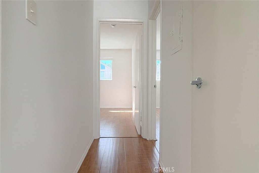 18619 Collins Street, Unit F29 Tarzana, CA 91356 - Photo 7 of 29 a view of empty room with wooden floor