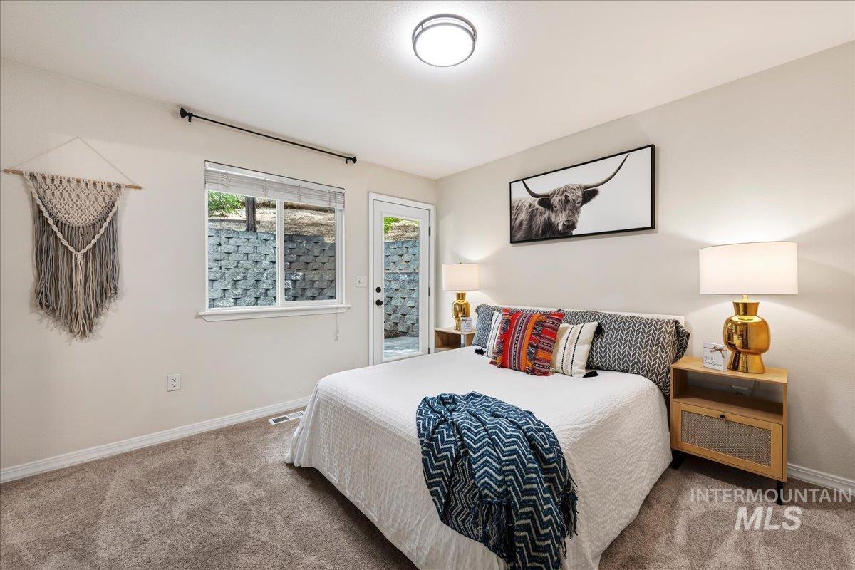 2356 West Hill Road Boise, ID 83702 - Photo 12 of 22 Plush carpet flooring, neutral painted walls, recessed lighting, and a window with blinds