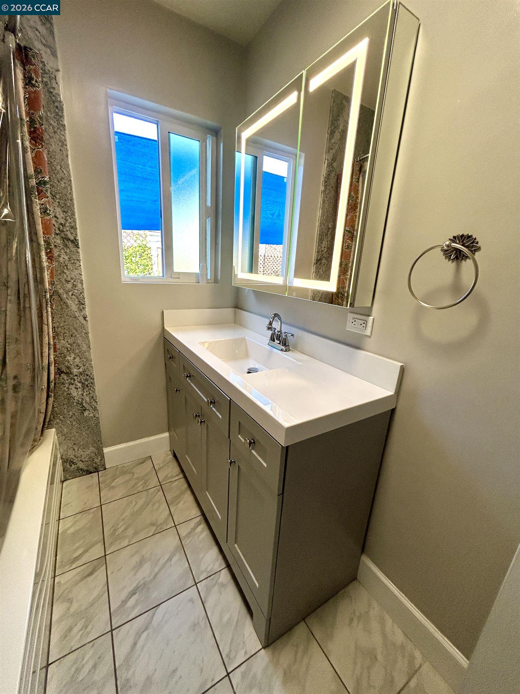 356 Frederic Avenue Hayward, CA 94544 - Photo 3 of 10 a bathroom with a sink vanity and a mirror