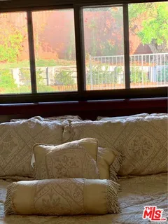 a living room with a couch and a large window