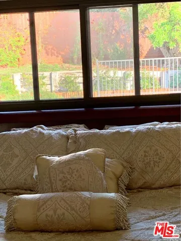 a living room with a couch and a large window