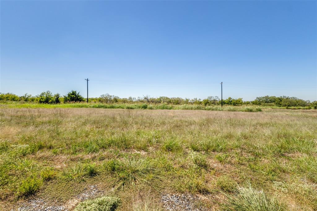 750 Wible Road Sherman, TX 75092 - Photo 22 of 26 a view of a lake with houses in the back