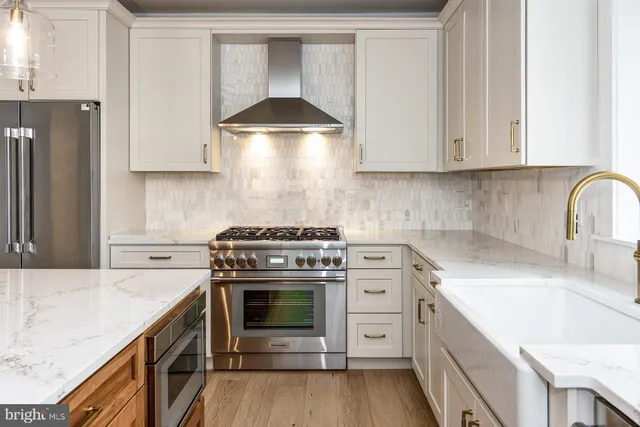 a kitchen with a stove and a sink