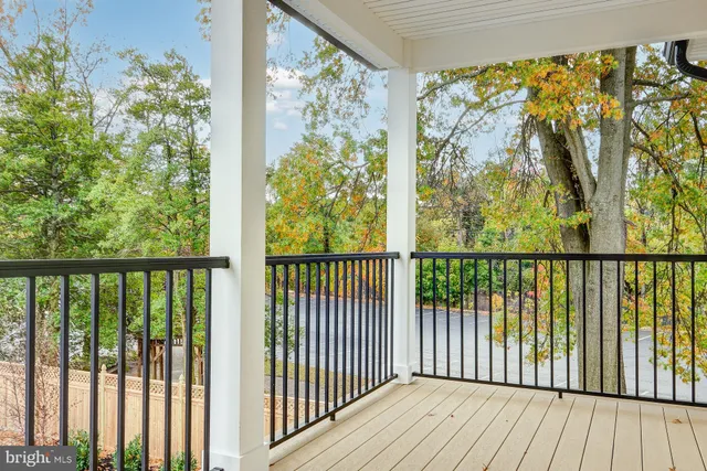a view of a balcony with wooden floor